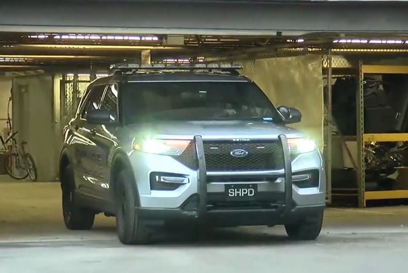 Decommissioned cruiser pulling out of police garage