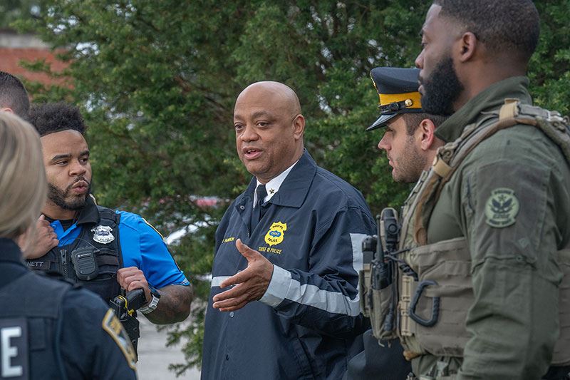 Chief Wayne D. Hudson speaking with officers