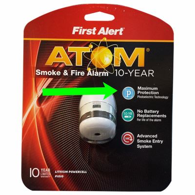 Photoelectric smoke alarm in packaging with a green arrow pointing to P in square